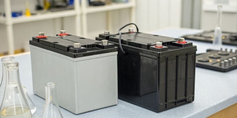 A side-by-side comparison of an LFP battery and an NMC battery pack