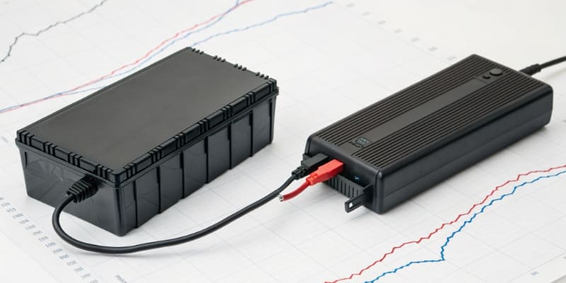 A Canadian flag next to an electric vehicle charging station