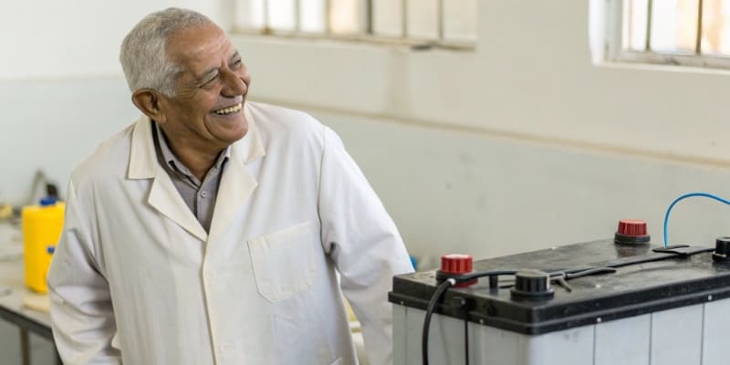 Engineer testing battery in laboratory