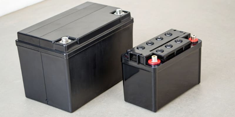 LiFePO4 vs Lead-Acid Battery A modern LiFePO4 battery next to a traditional lead-acid battery
