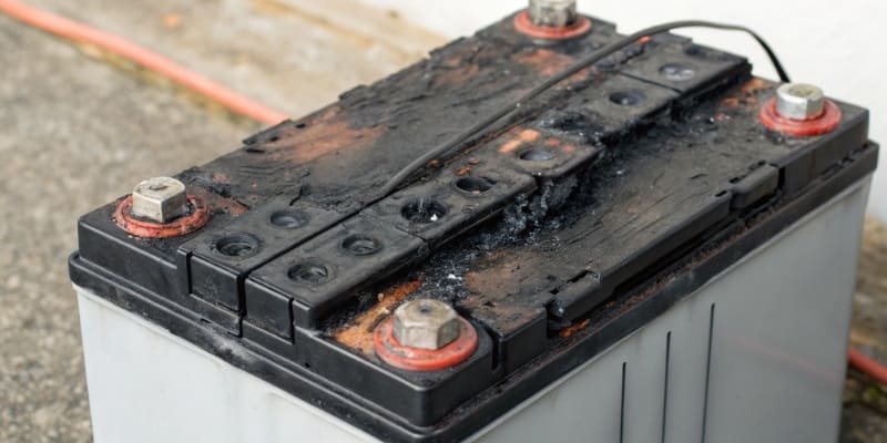 An image depicting a damaged or swollen battery pack due to BMS failure