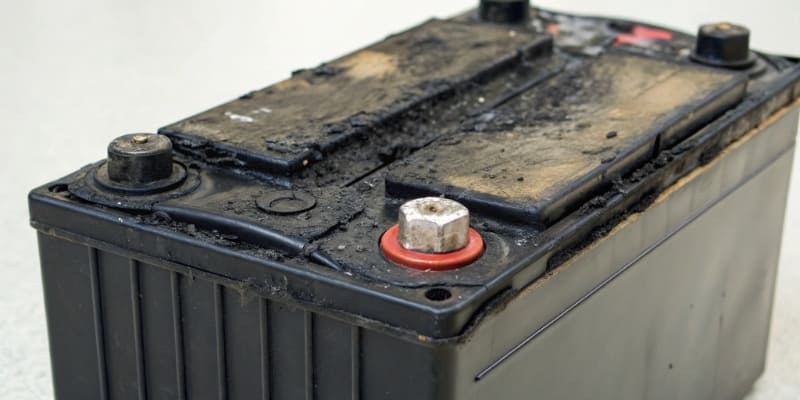 A picture of a swollen and damaged lithium battery