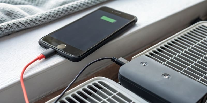 An illustration comparing a traditional battery tab with an all-tab design