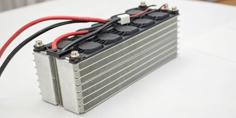 An exploded view of a battery pack showing cell spacing and enclosure design