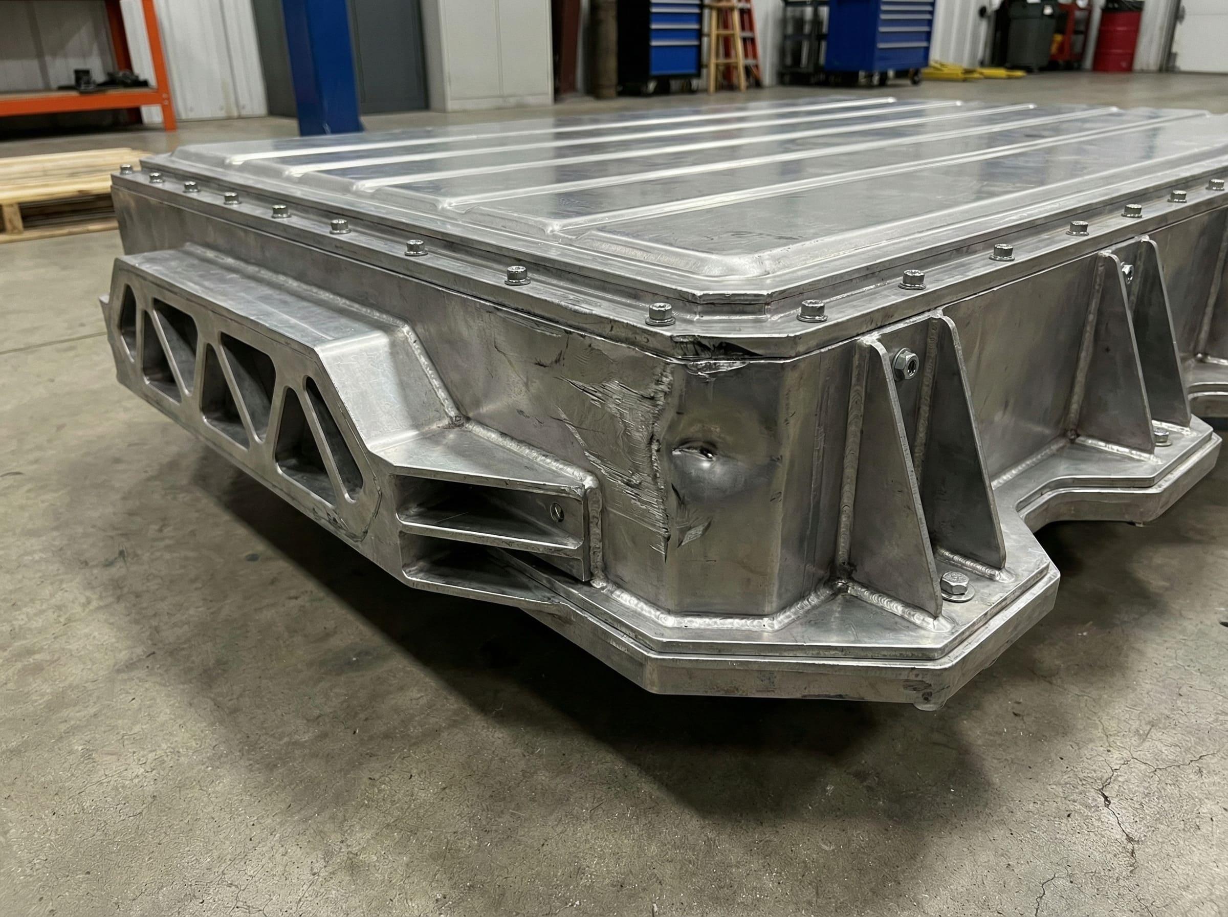 Firefighters extinguishing an electric vehicle fire