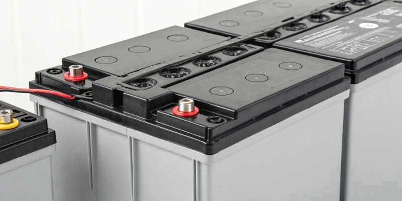 A certified battery pack with safety labels and a visible BMS board