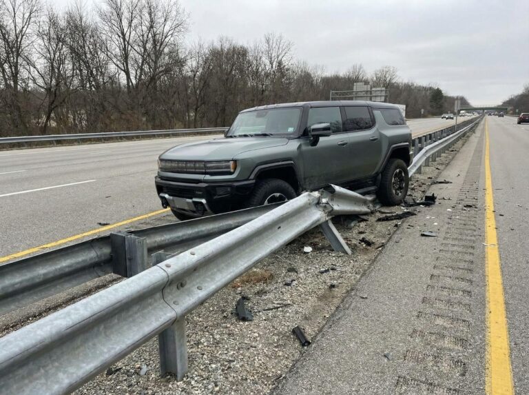 Electric SUV crash with highway guardrail