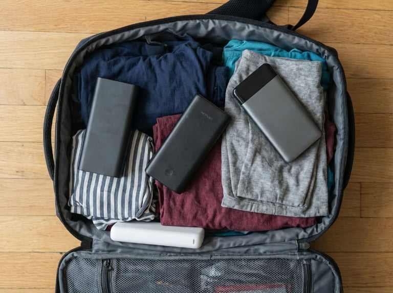 Three power banks in travel luggage