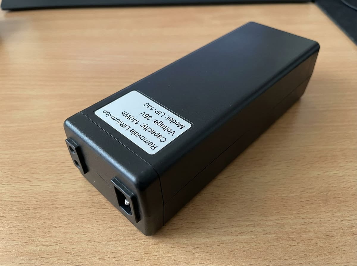 A person gliding through an airport terminal on a rideable suitcase